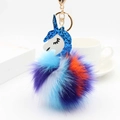 Close-up of a colorful fluffy unicorn keychain with glitter horn and golden clasp - 12*8cm / Blue
