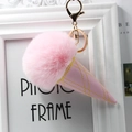 Close-up of pink fur pompom ice cream keychain with golden embroidery on leather cone - Light Pink