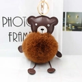 Detail of brown PU leather bear keychain with fluffy faux fur ball and gold metal clasp - Brown