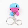 Detail van blauwe en roze bellen met ster-uitsparingen voor sleutelhangers en tasaccessoires - Roze Blauw