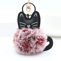 Close-up of fluffy red and white faux fur kitten keychain with a golden metal clasp - Wine Red And White With Gold Ring