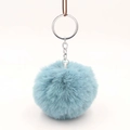 Detail shot of light blue faux fur pompom keychain with silver metal ring and chain - Lake Blue