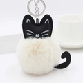 Detail of plush cat keychain with fluffy white pom pom, black leather ears and metal ring - Off-white