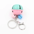 Detail view of colorful bell keychain with star cutouts and silver lobster clasp - Pink & Green