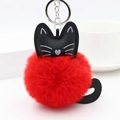 Detailed view of the bright red faux fur cat pompom keychain with silver metal hardware - Red
