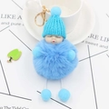 Detail of light blue plush sleeping baby keychain with knit hat and golden clasp - Blue