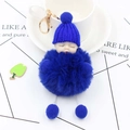 Detail view of royal blue plush sleeping baby doll keychain with golden lobster clasp - Sapphire Blue