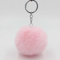 Close-up of soft pink faux rabbit fur pom pom keychain with silver metal ring - Light Pink