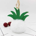 Detail of white faux fur pineapple keychain with green leather leaves and gold ring - White