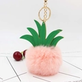 Detail of pink plush pineapple keychain with green PU leaves and gold metal ring link - Pink