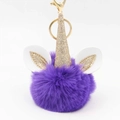 Detailed view of purple plush unicorn keychain with gold horn and lobster clasp - Purple