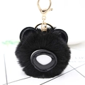 Détail d'un mignon porte-clés panda en peluche noire avec une boucle en métal doré - Noir