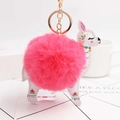 Detail of alpaca plush keychain with pink pom-pom, white leather, and gold hardware - Watermelon red