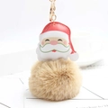 Close-up of Santa Claus plush keychain with a fluffy light brown faux fur pom pom ball - Khaki