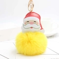 Detalle de colgante de Papá Noel en cuero con pompón amarillo y llavero dorado de lujo - Amarillo