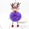 Christmas reindeer plush keychain with purple faux fur ball and red hat on aesthetic background - Purple
