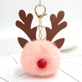 Detail of pink Christmas reindeer plush ball keychain with golden metal spring clasp - Pink