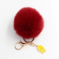 Detail of red faux fur pompom keychain with golden metal clasp and yellow duck charm - Pom Pom Diameter 8cm / Burgundy