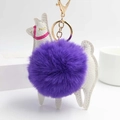 Detail of white alpaca keychain with a soft purple faux fur pompom and gold metal ring - Purple