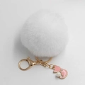 Detail of white faux fur pompom keychain with golden lobster clasp and pink enamel fox charm - Pom Pom Diameter 8cm / White