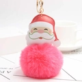 Detail of Santa Claus plush keychain with a soft pink fur ball and golden metal ring - Watermelon red