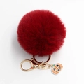 Dunkelroter flauschiger Bommel Schlüsselanhänger mit goldenem Ring und Halloween Kürbis - Pompon Durchmesser 8cm / Burgunderrot