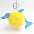 Cute dolphin plush pompom keychain with yellow fur ball and blue textured accents - Yellow