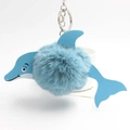 Detail view of the plush blue pom-pom dolphin keychain with silver metal ring - Lake Blue
