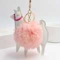 Detail view of pink plush pom pom alpaca keychain with gold metal ring and lobster clasp - Pink