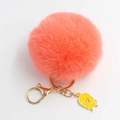Portachiavi con pompon arancione corallo e ciondolo a forma di uccellino giallo - Diametro Pon Pon 8cm / Arancione