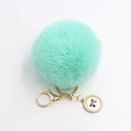 Mint green pompom keychain with gold-plated metal clasp and pearl bow charm ornament - Pom Pom Diameter 8cm / Mint Green