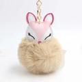 Close-up of sleeping fox plush keychain with soft brown faux fur ball and gold metal hook - Khaki