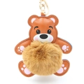 Detail eines braunen Teddybär-Schlüsselanhängers mit Plüschpompon und goldenem Verschluss - Pompon Durchmesser 8cm / Kaffeebraun