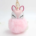 Detailed close-up of fluffy pink faux fur pompom keychain with creative fox head design - Pink
