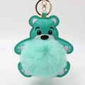 Detailansicht eines minzgrünen Leder-Teddybären-Schlüsselanhängers mit flauschigem Pompon - Pompon Durchmesser 8cm / Mintgrün