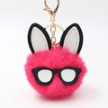 Detail view of a rose red fluffy faux fur bunny keychain with glasses and golden metal clasp - Rose Red