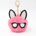 Detail of pink faux fur rabbit pompom keychain with chic black round glasses and gold hardware - Deep Pink