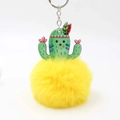 Detail of cute cactus acrylic charm with a large bright yellow fluffy pom-pom keychain - Yellow