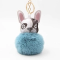 Detail eines blauen Bommel Schlüsselanhängers mit Bulldoggen Lederkopf und Goldring - Seeblau