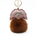 Close-up of a cute plush dog keychain with dark brown faux leather and soft pom-pom detail - Pom Pom Diameter 8cm / Brown