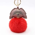 Detail of red plush ball keychain with a brown leather dog charm and gold metal ring - Pom Pom Diameter 8cm / Red