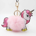 Close-up of pink fluffy unicorn plush keychain with golden lobster clasp for handbags - Light Pink