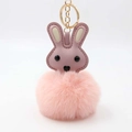 Cute pink bunny keychain featuring a plush pom-pom and faux leather head with gold hardware - Pom Pom Diameter 8cm / Pink