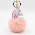 Detail of colorful unicorn pom pom keychain with pink fur ball and golden metal ring - 8x12cm / Pink