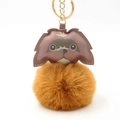 Detailed close-up of a brown puppy leather head and fluffy pom-pom charm keychain - Pom Pom Diameter 8cm / Coffee