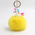 Unicorn plush pom pom keychain with white silicone toy and bright yellow faux fur ball - Yellow