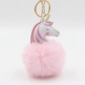 Detail of pink unicorn plush pom pom keychain with gold metal ring and rainbow mane - 8x12cm / Light Pink
