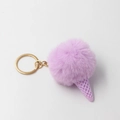 Detailed close-up of lavender faux fur pom pom ice cream keychain with golden ring - Light Purple