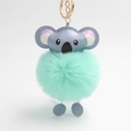 Close-up of mint green faux fur koala keychain with golden metal ring and chain - Light Green