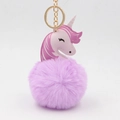 Detailed view of a cute pink unicorn keychain featuring a soft purple plush pom-pom ball. - 8x14cm / Light Purple